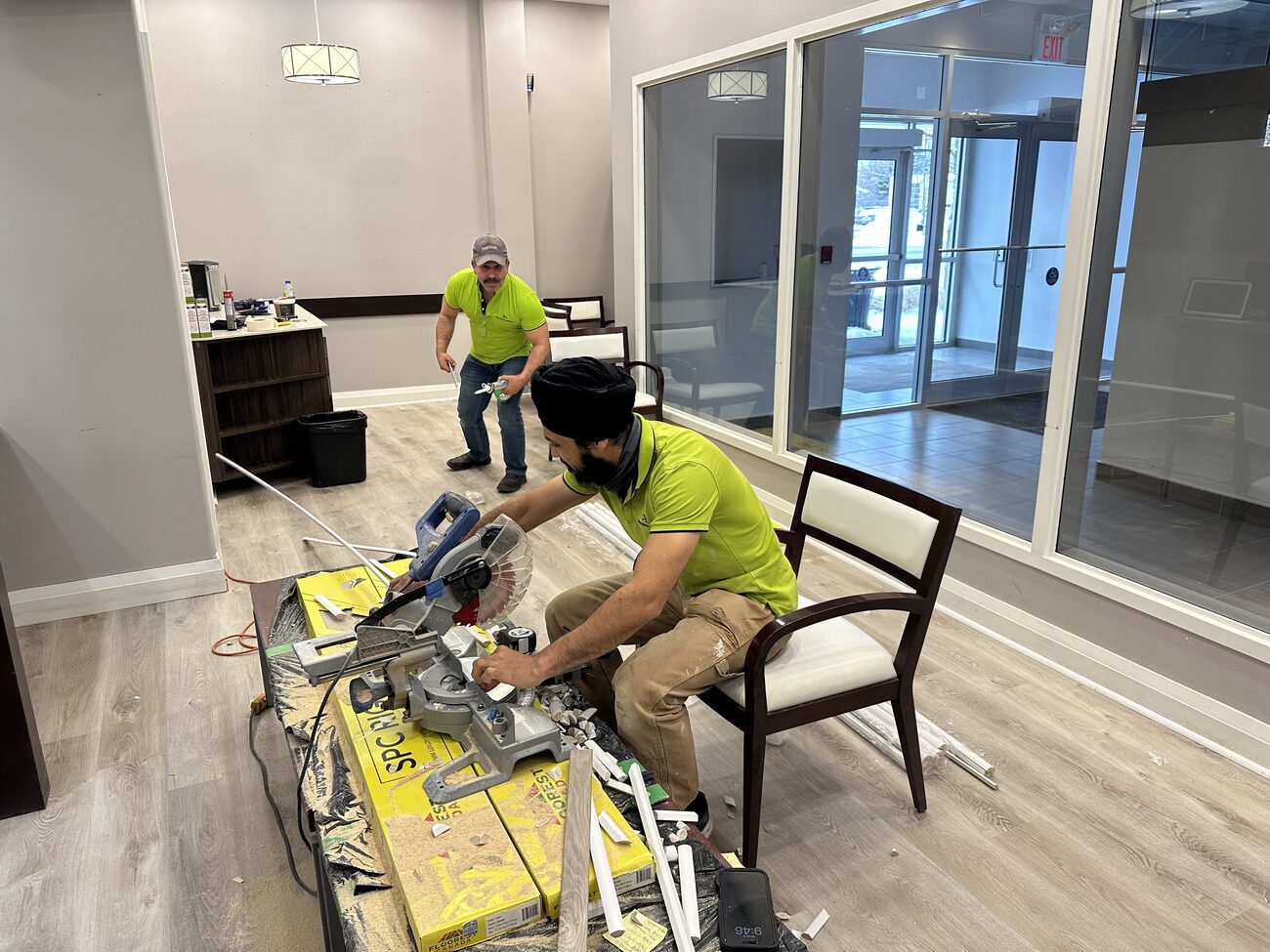Cutting and laying the new luxury vinyl flooring.