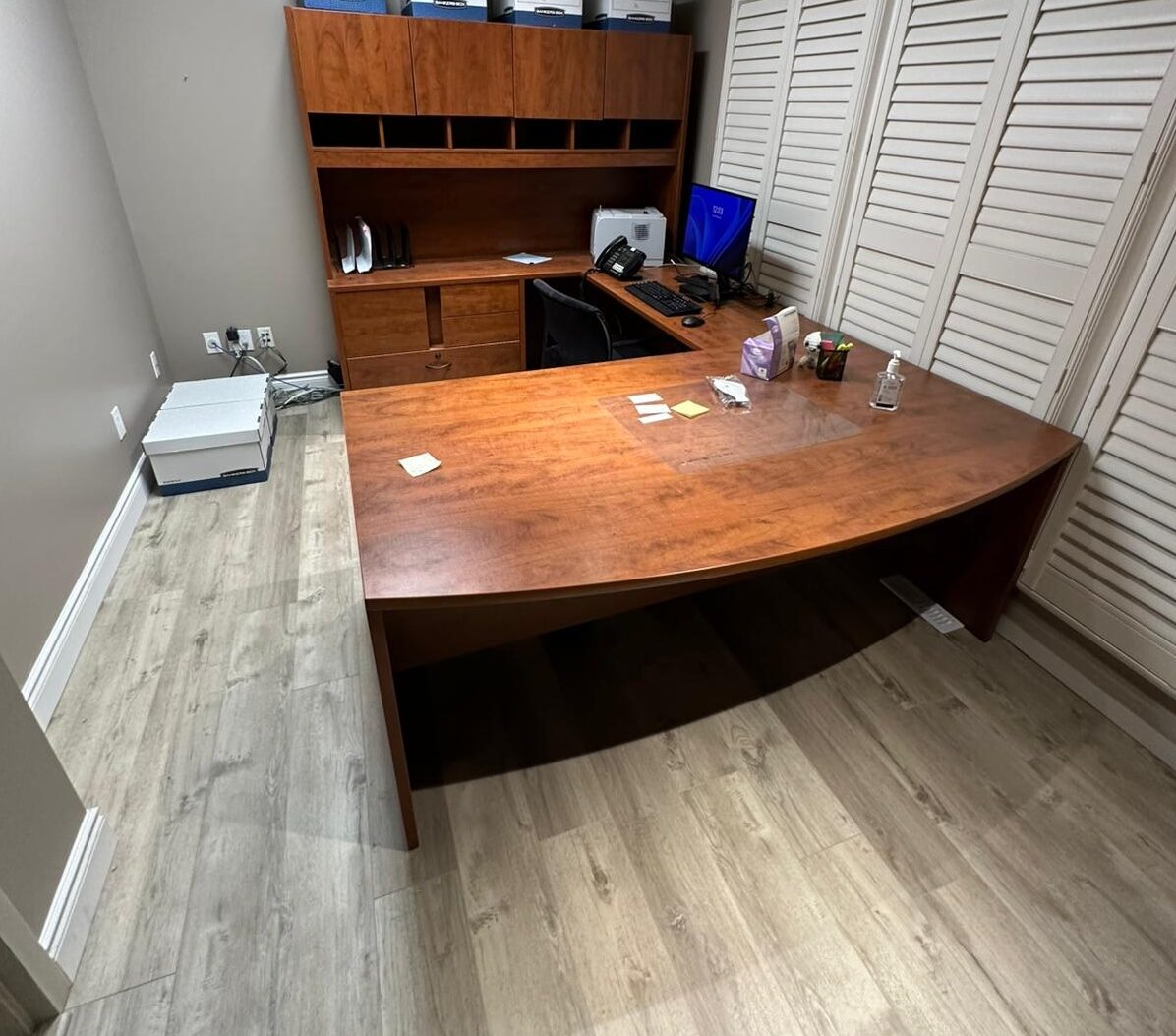 A private office with fresh paint and new flooring.