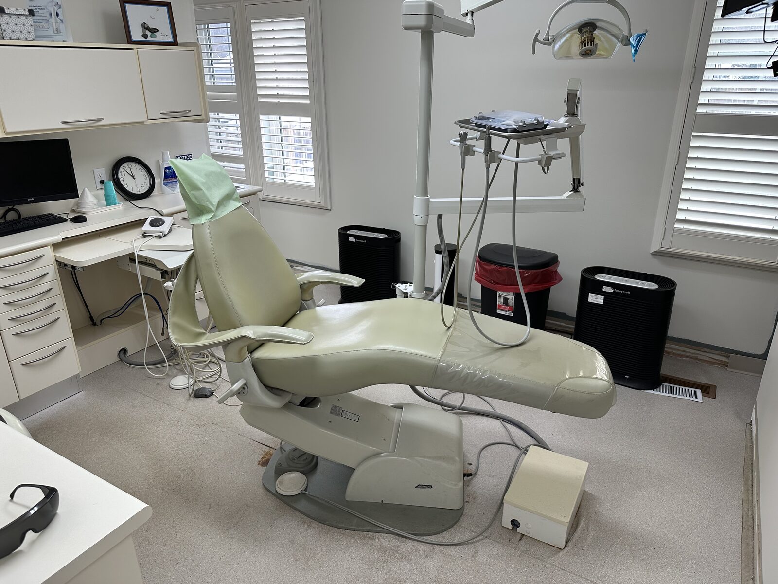 A treatment room before the repaint and new floor.