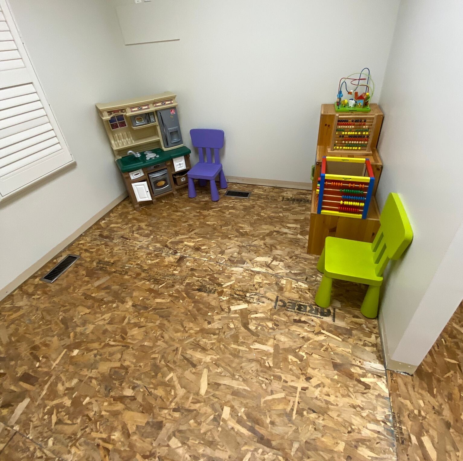 A room stripped back to new subfloor during the after-hours work.