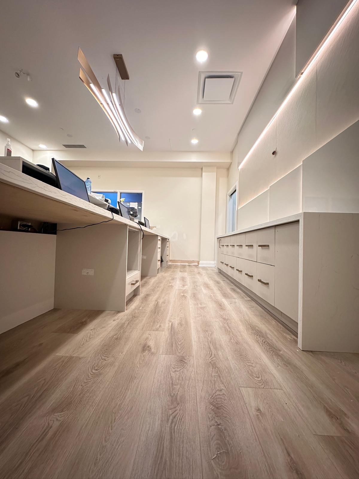 New cabinetry and millwork behind the reception