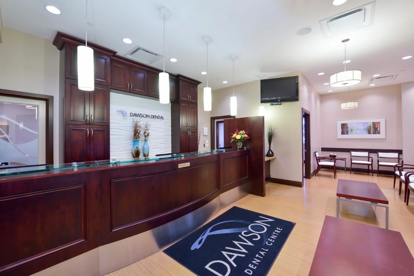 The original reception — dark wood millwork and dated finishes.