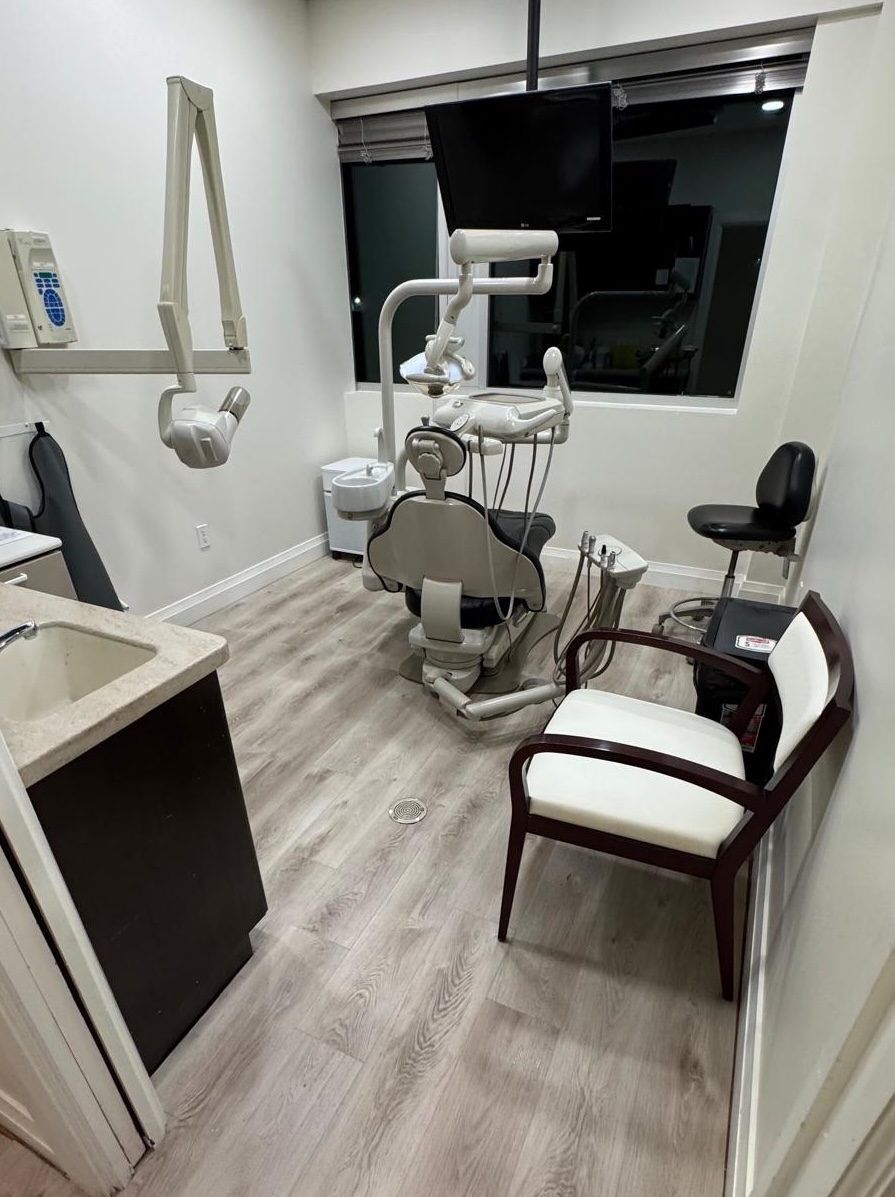 A refreshed operatory: new light wood-look flooring throughout.
