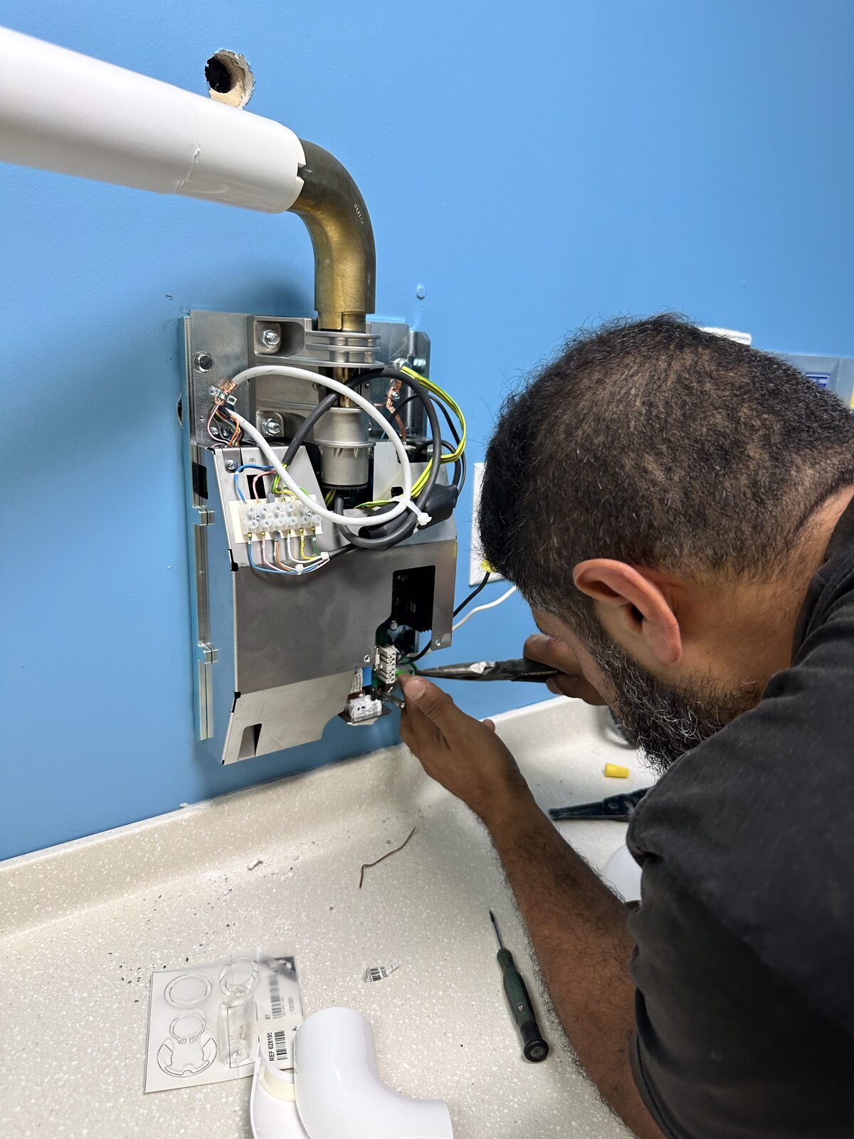 Wiring the X-ray control box and running data cabling.