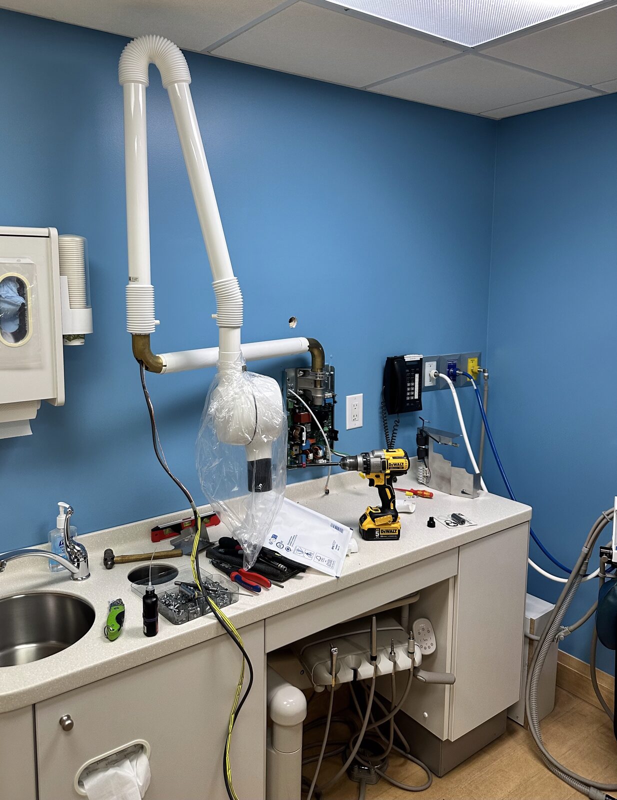 Installing operatory equipment against the lead lined wall.