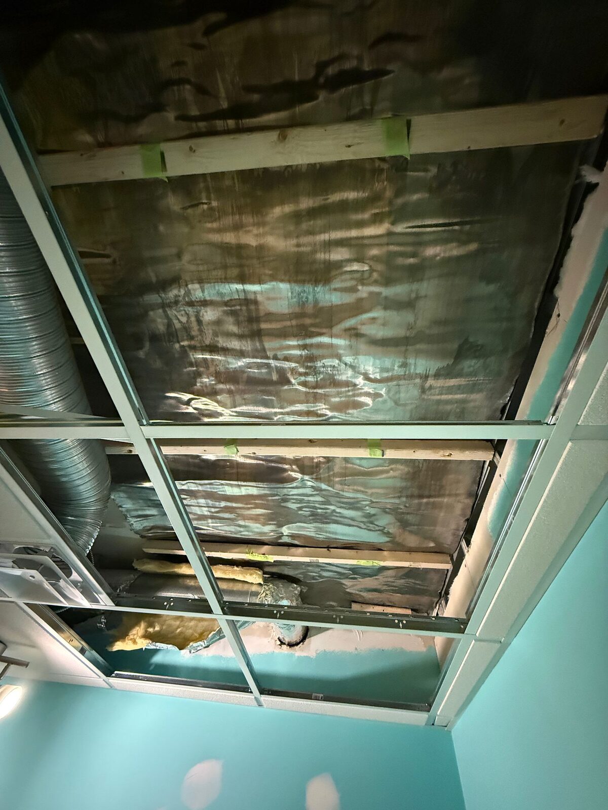 Lead sheeting installed across the ceiling grid above the imaging area.