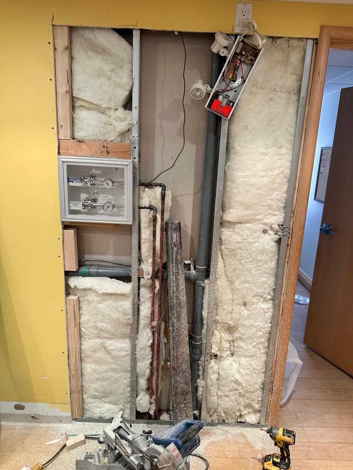 A wall opened up with lead lining and insulation during rough-in.
