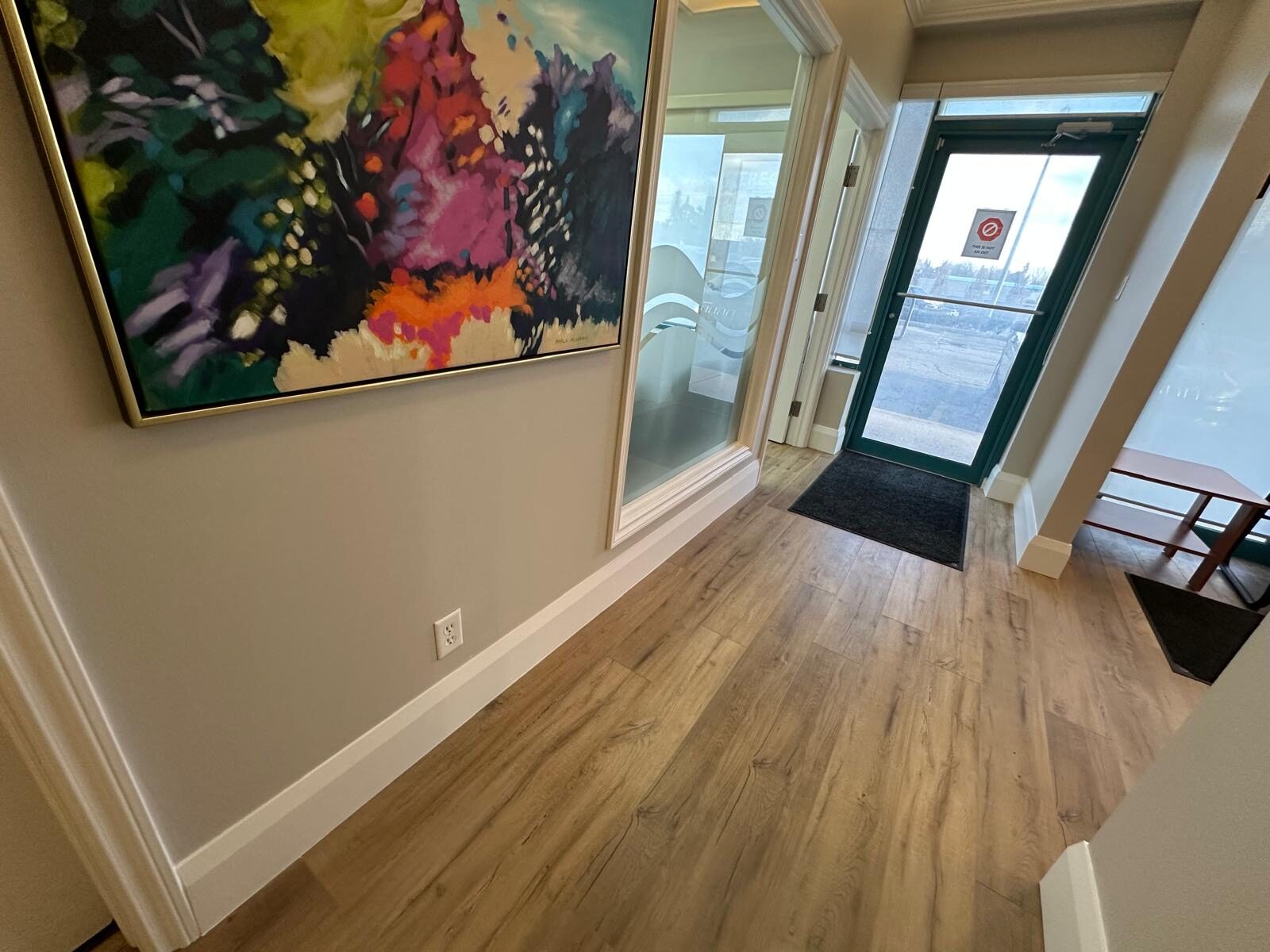 The clinic entrance and reception with new flooring and a bright, contemporary feel.