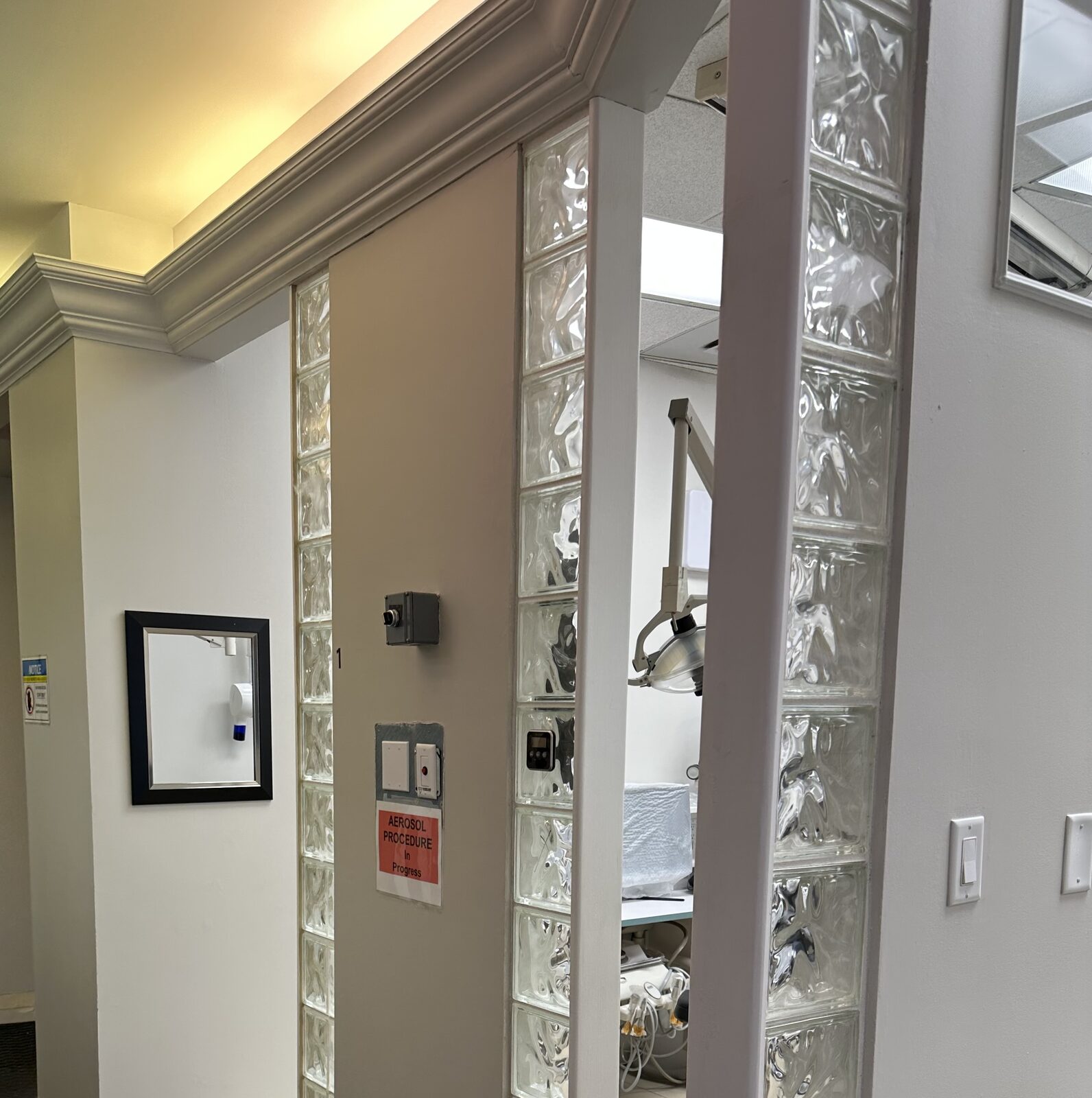 A clinic hallway 'sporting' an 80s glass-block wall, will be missed by some :)