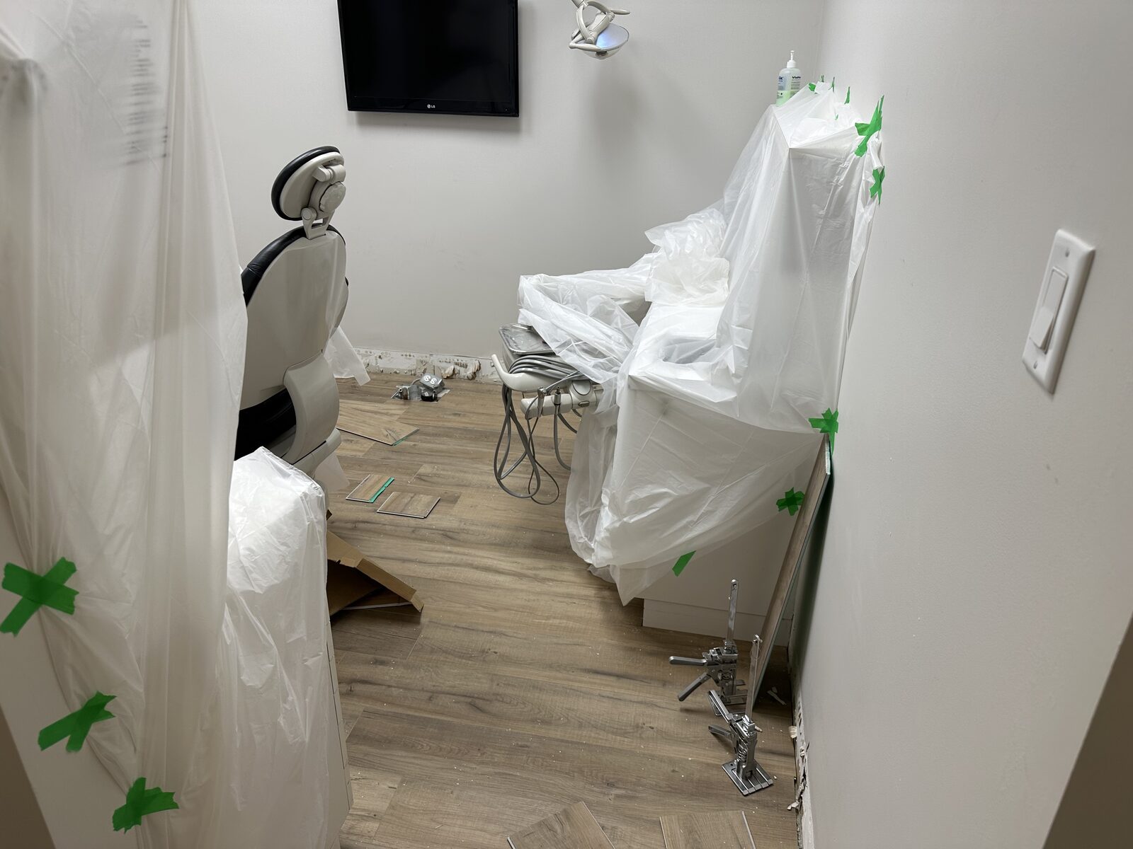 A treatment room sealed off and taped during the phased installation.
