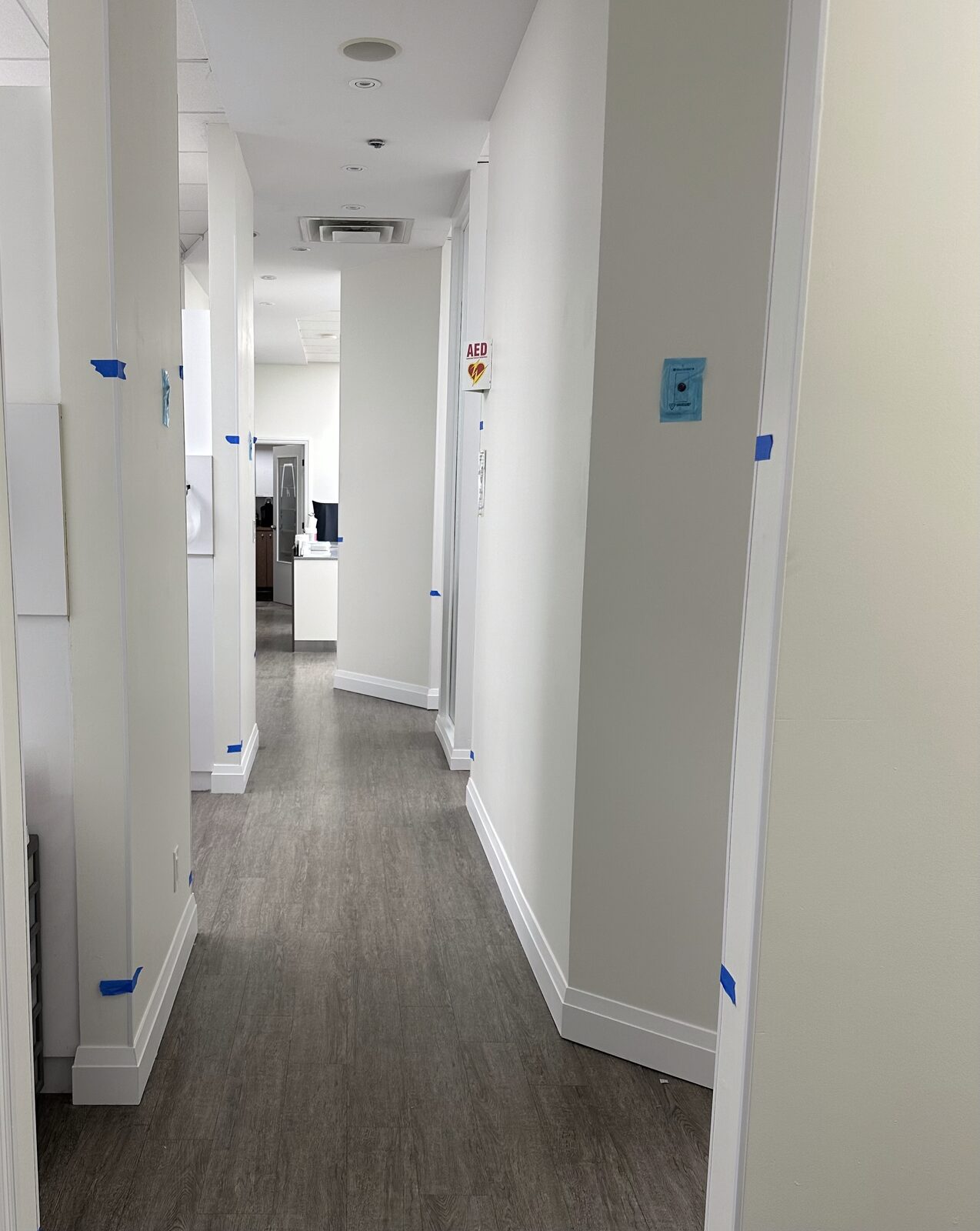A repainted hallway with clean white walls.