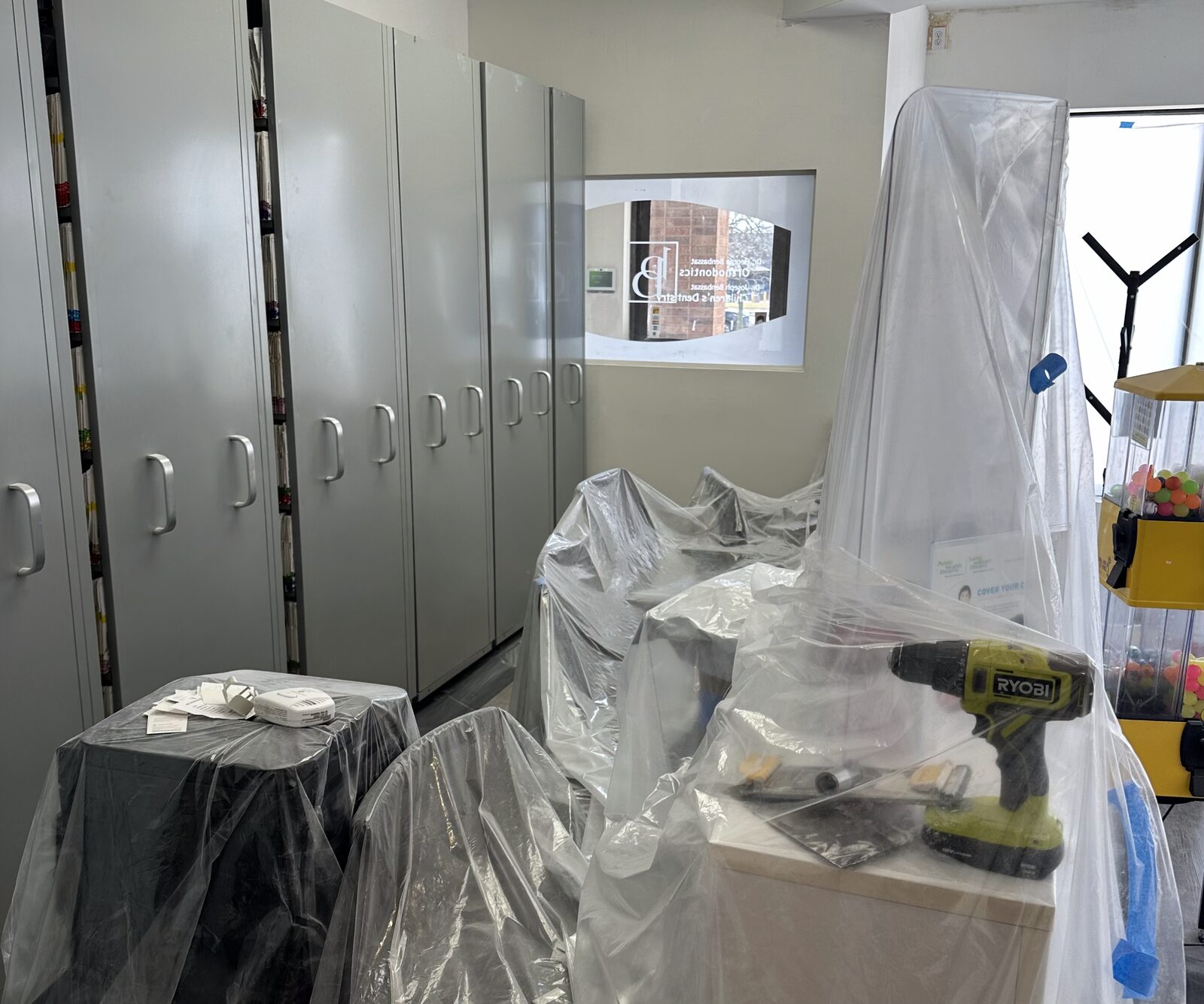 Equipment wrapped and cabinetry protected during the refresh.