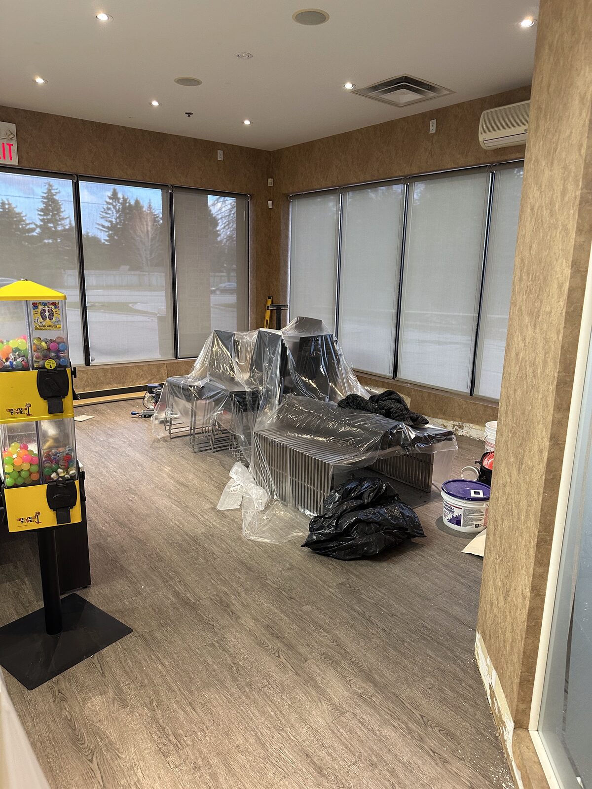 The waiting area prepped and furniture protected before painting.