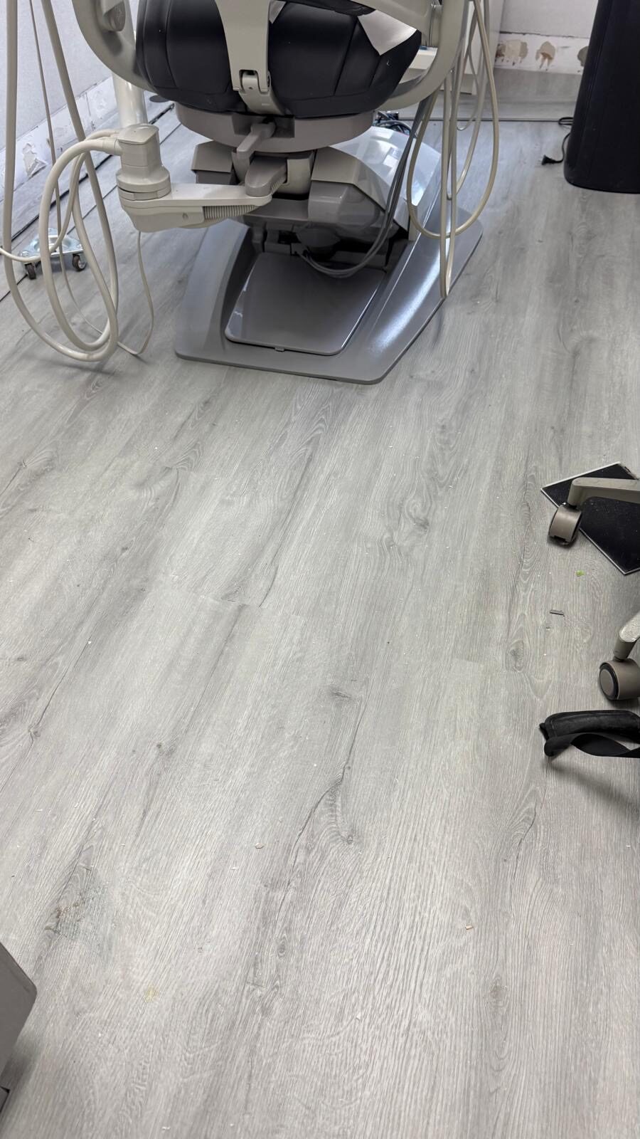 The new wood-look LVT going down across the clinic.