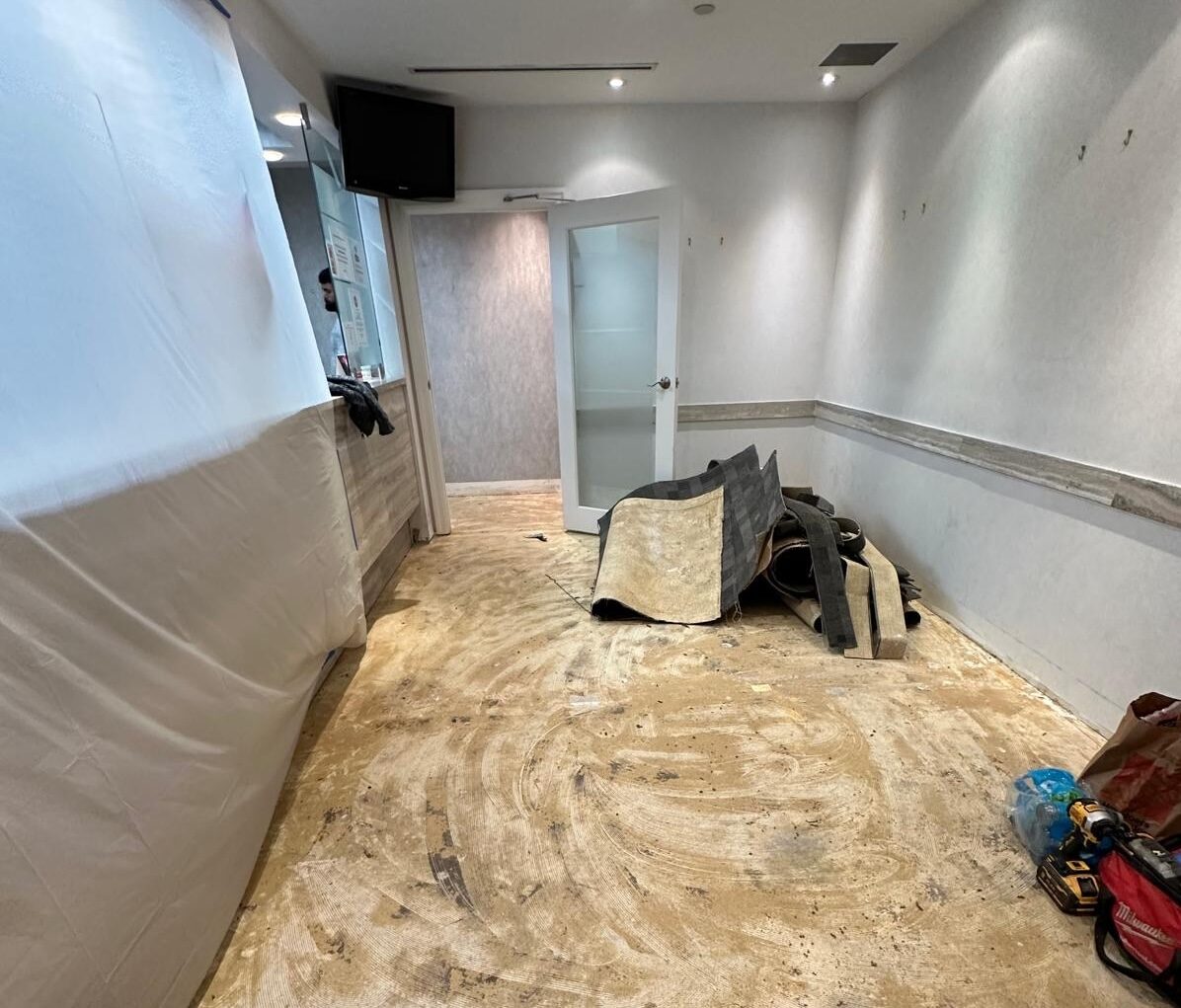 A room stripped back to the subfloor during the flooring replacement.