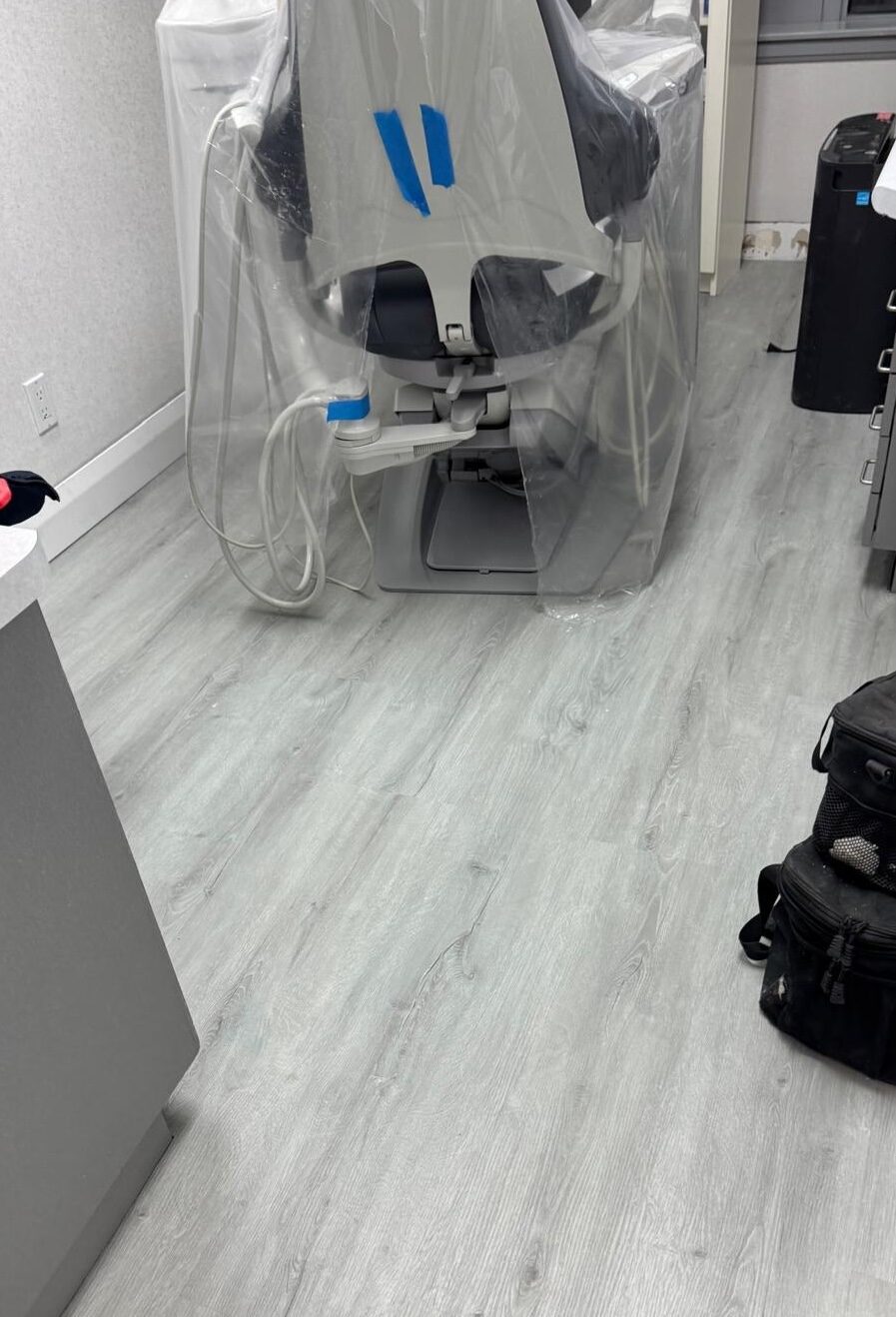 Equipment wrapped and protected as the new floor is completed around it.